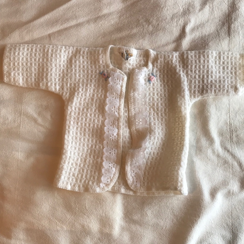 Baby sweater with lace